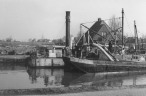 Onderneming - barge unloading dredger