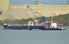Grab dredger KEN HARVEY with the anchor tug TURTLE at Brisbane | Image by John Wilson